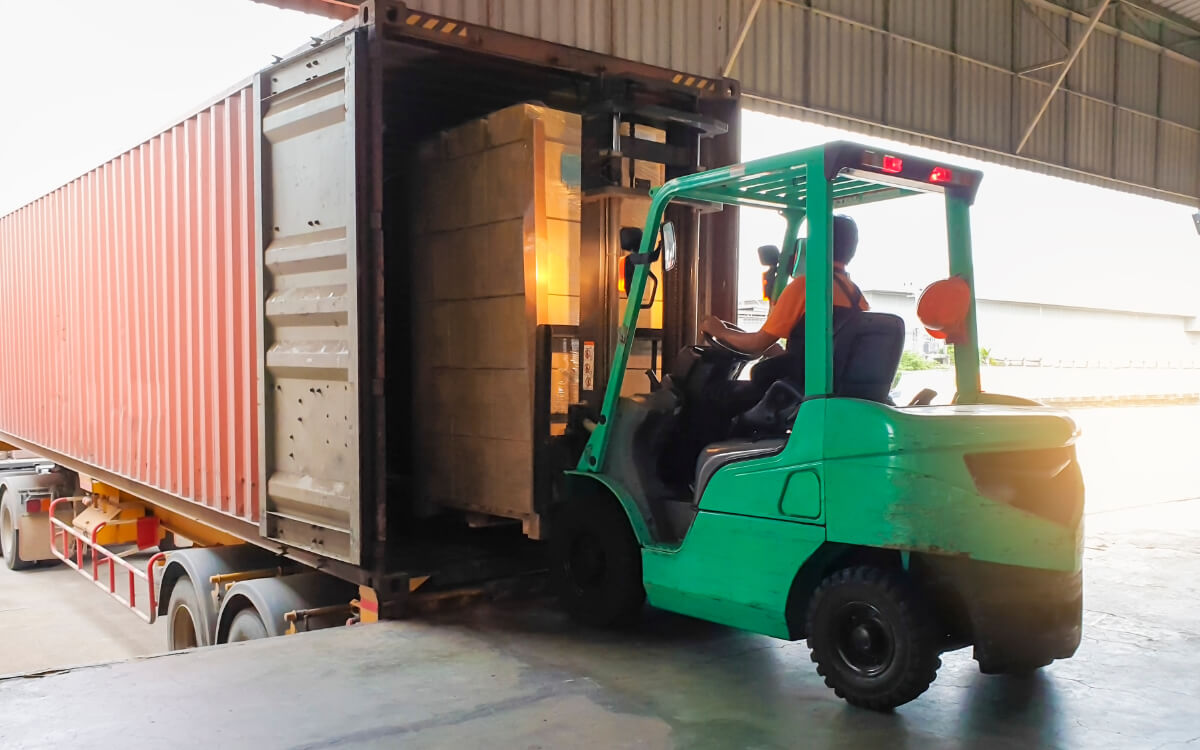 Forklift loading shipping container